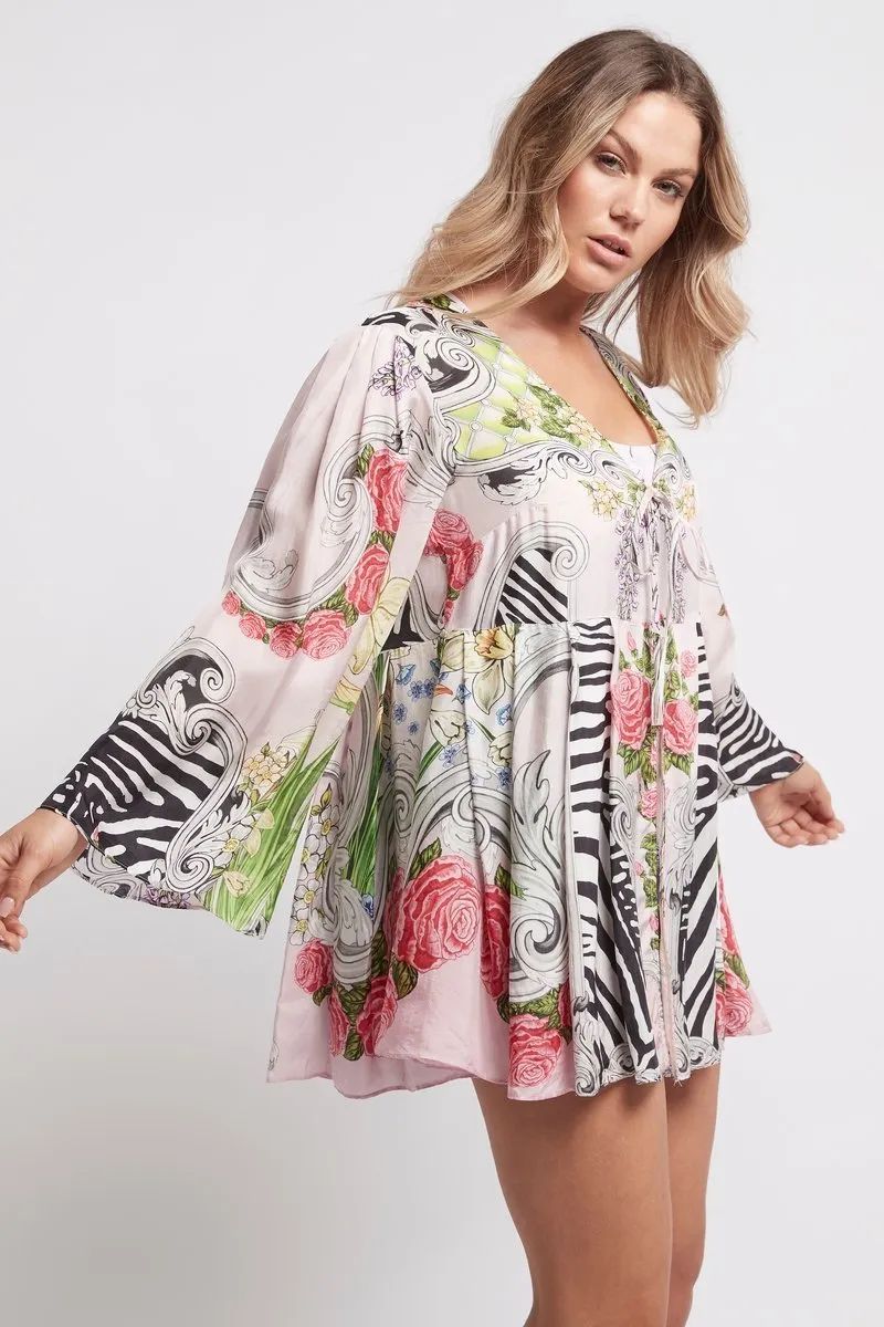 A LADY IN PINK SHORT ROBE