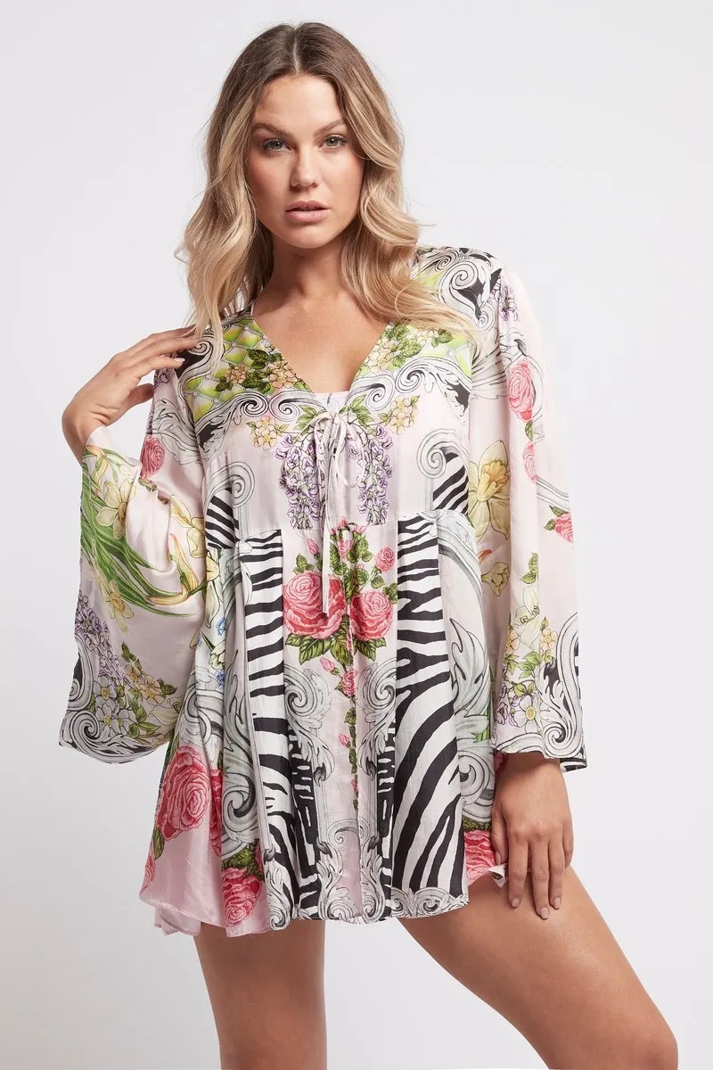 A LADY IN PINK SHORT ROBE