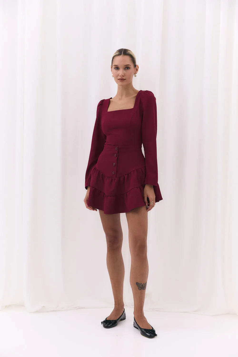 Burgundy skirt with a shaped yoke