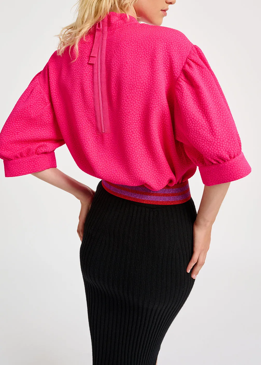 Neon pink top with puffed sleeves