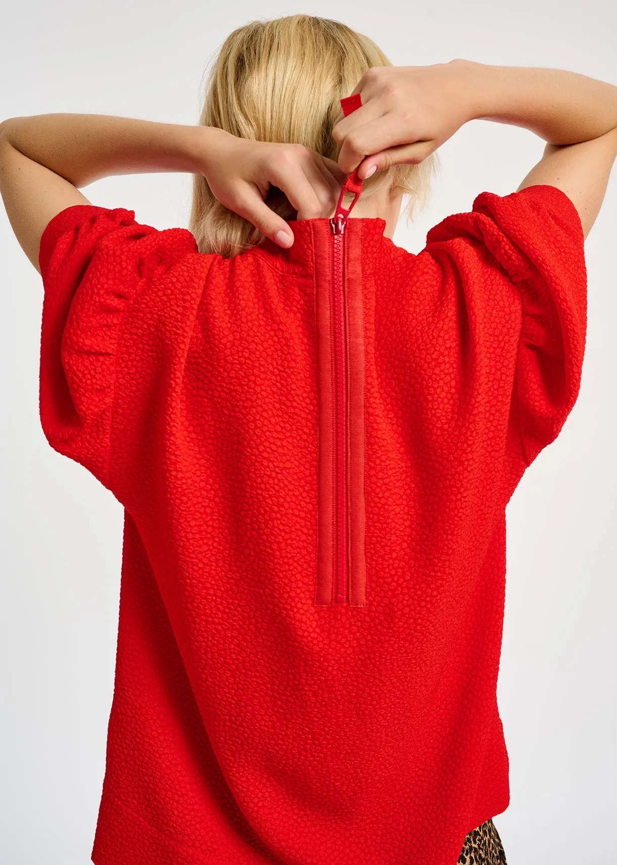 Red top with puffed sleeves