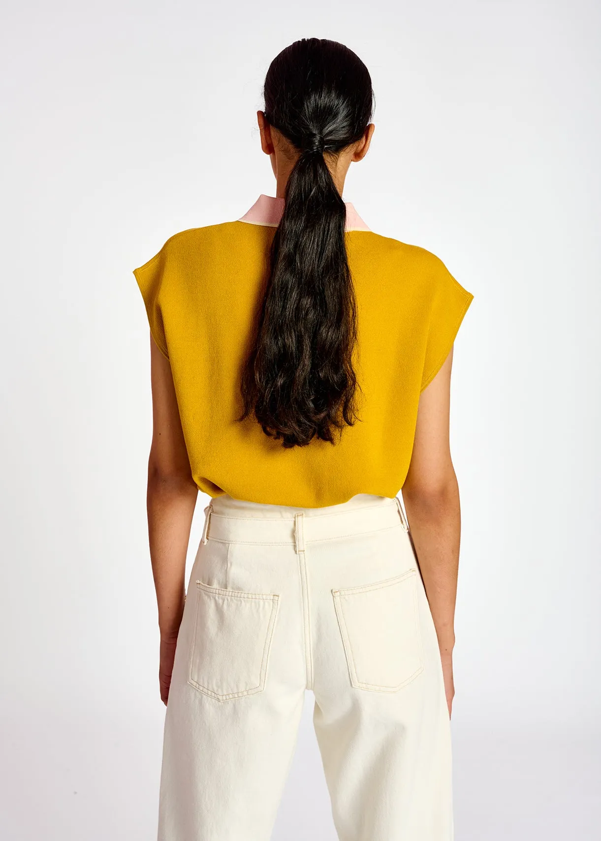 Yellow sleeveless polo top with contrasting collar